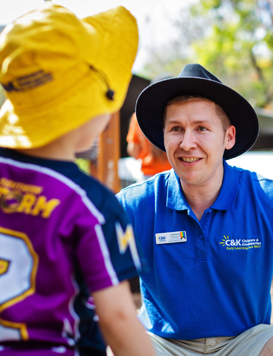 Educator smiling at kindy child