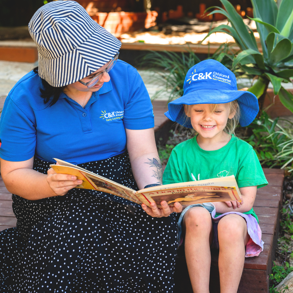 C&K Kindergarten and Childcare Educator reading to child