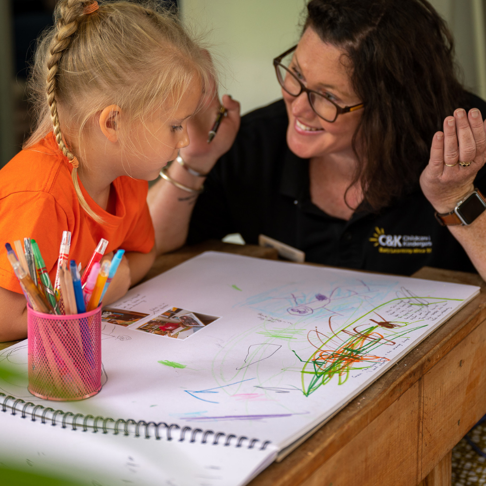 C&K kindy child learning with happy teacher