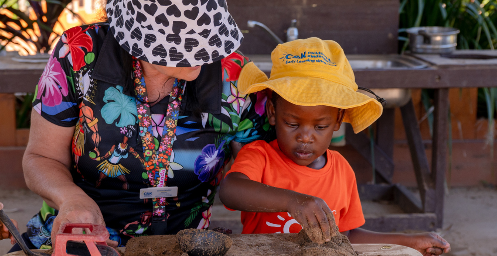 C&K education and kindy child playing with sand