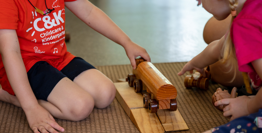 C&K children playing with wooden blocks