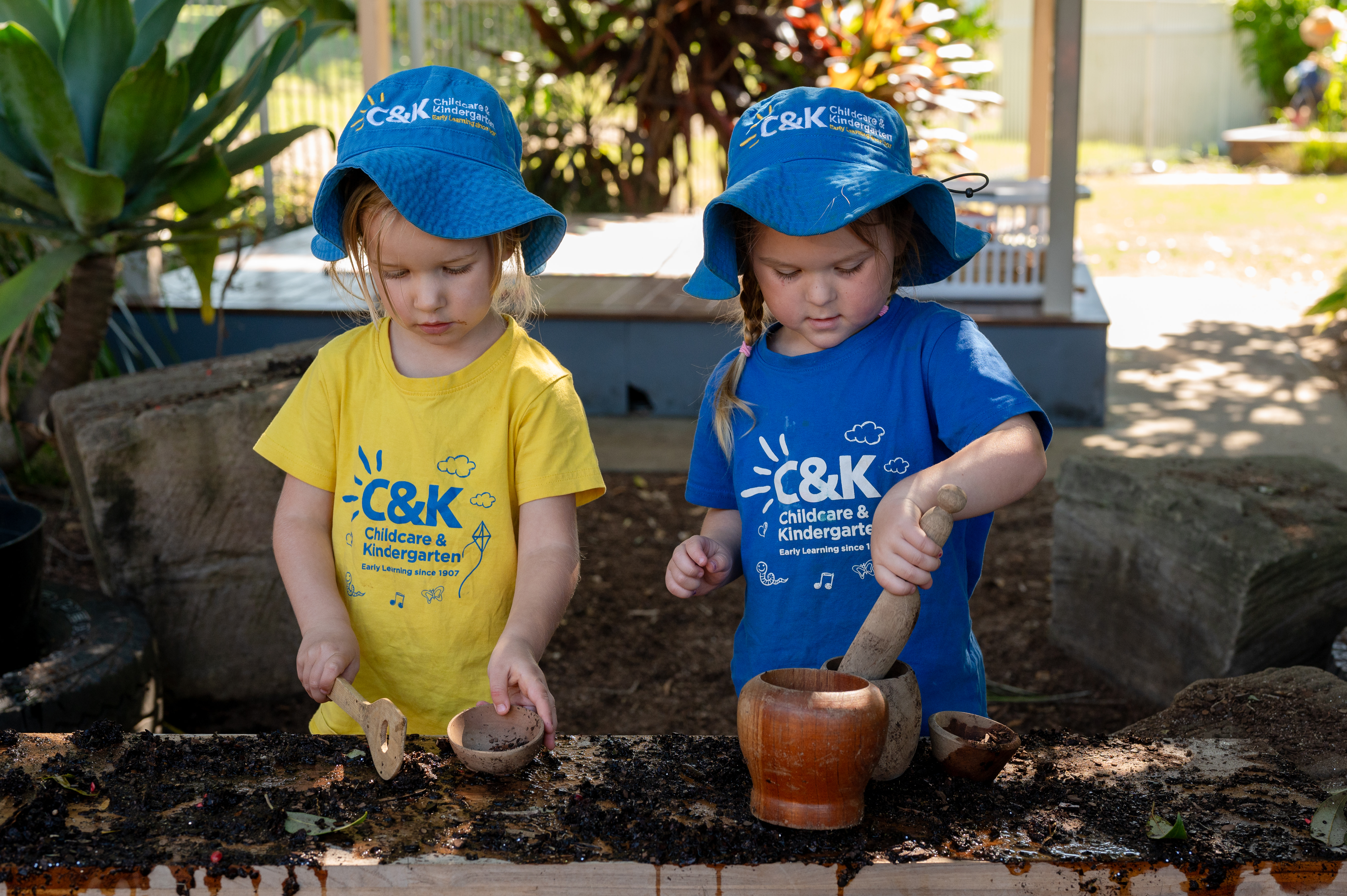 two children playing in mud