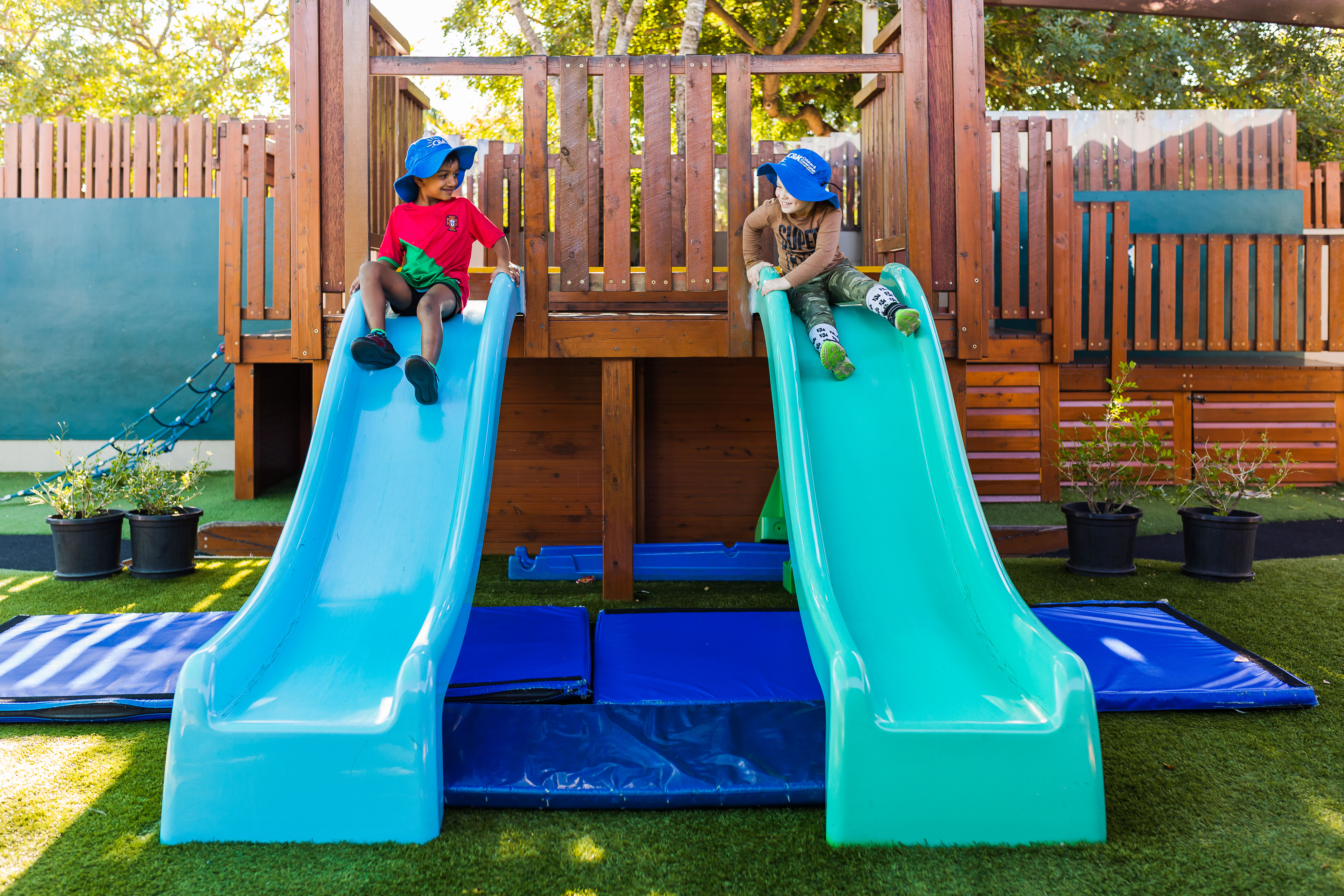 two children on both slides