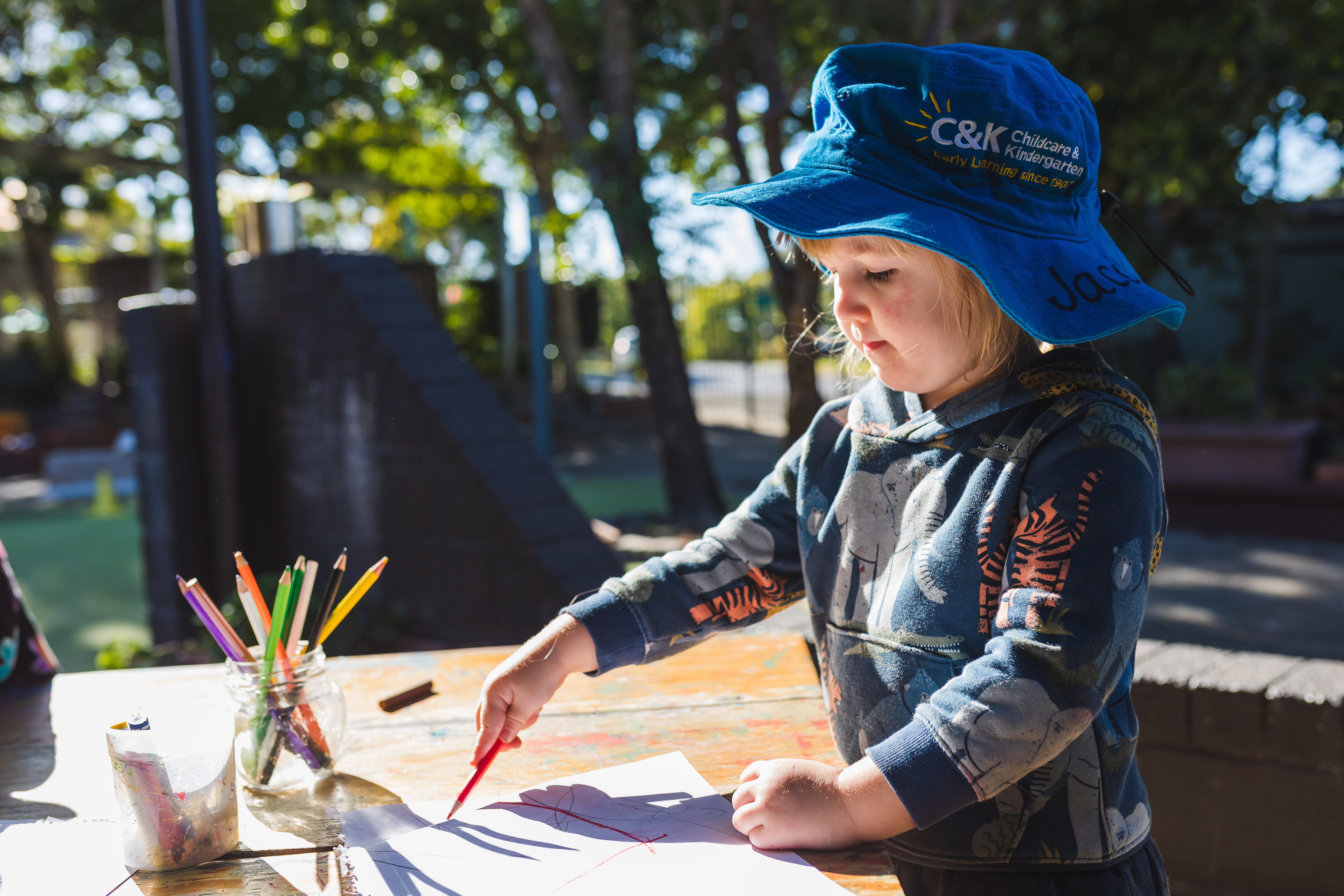 child outside drawing